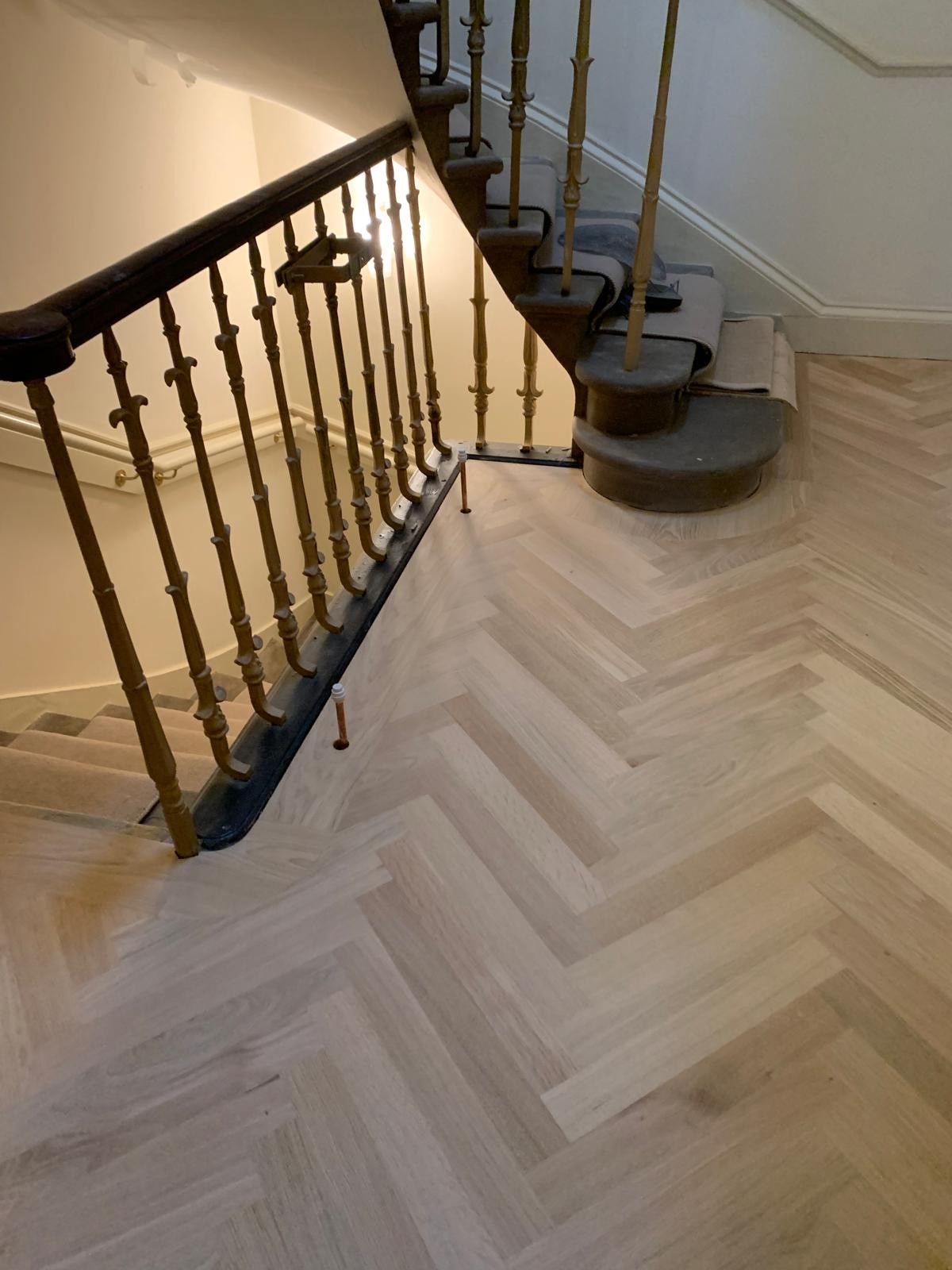 Photo of newly laid hardwood flooring in a landing stairwell, performed by SR Flooring in Edinburgh